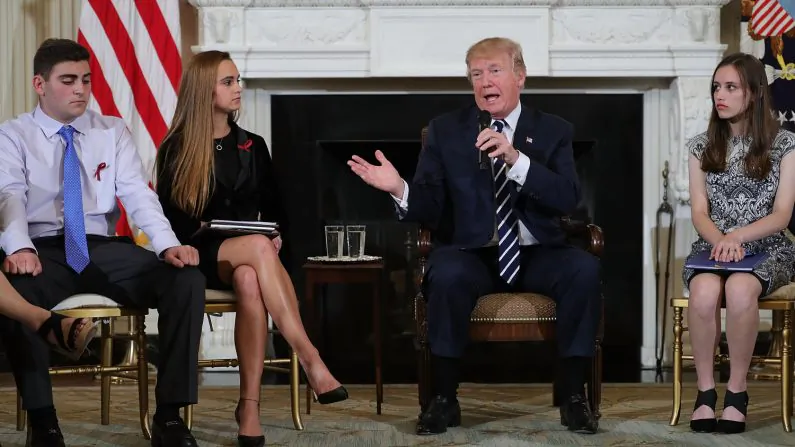 U.S. President Donald Trump (C) speaks during a listening session with Marjory Stoneman Douglas High School students who survivied last week's mass shooting in the State Dining Room at the White House February 21, 2018 in Washington, DC. (Chip Somodevilla/Getty Images)