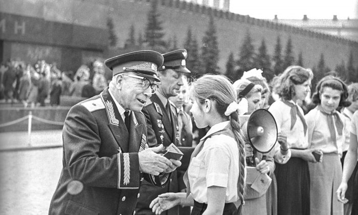 Children are given their Komsomol memberships in Moscow’s Red Square on May 19, 1968. The Soviet Union allegedly used the Komsomol camps to experiment on pedophilia. (RIA NOVOSTI ARCHIVE)