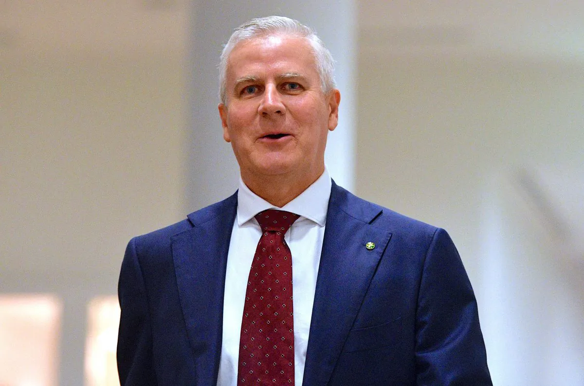 Australia's Minister for Veterans' Affairs Michael McCormack reacts as he walks to a meeting of the country's National Party in Canberra, Australia, Feb. 26, 2018. (AAP/via Reuters)