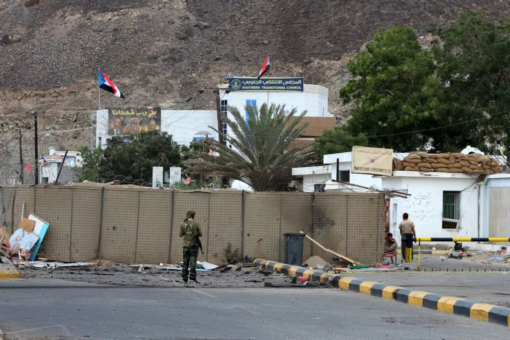 Fighters from the separatist Southern Transitional Council gather on Feb. 25, 2018, at the site of two suicide car bombings that targeted the headquarters of an anti-terror unit the day before, in the southern Yemeni port of Aden.
Five people, including security officers and a child, died in the blasts at the headquarters of an anti-terror unit in the Tawahi district, Aden security chief General Shallal al-Shae said.
(Saleh Al-Obeidi/AFP/Getty Images)