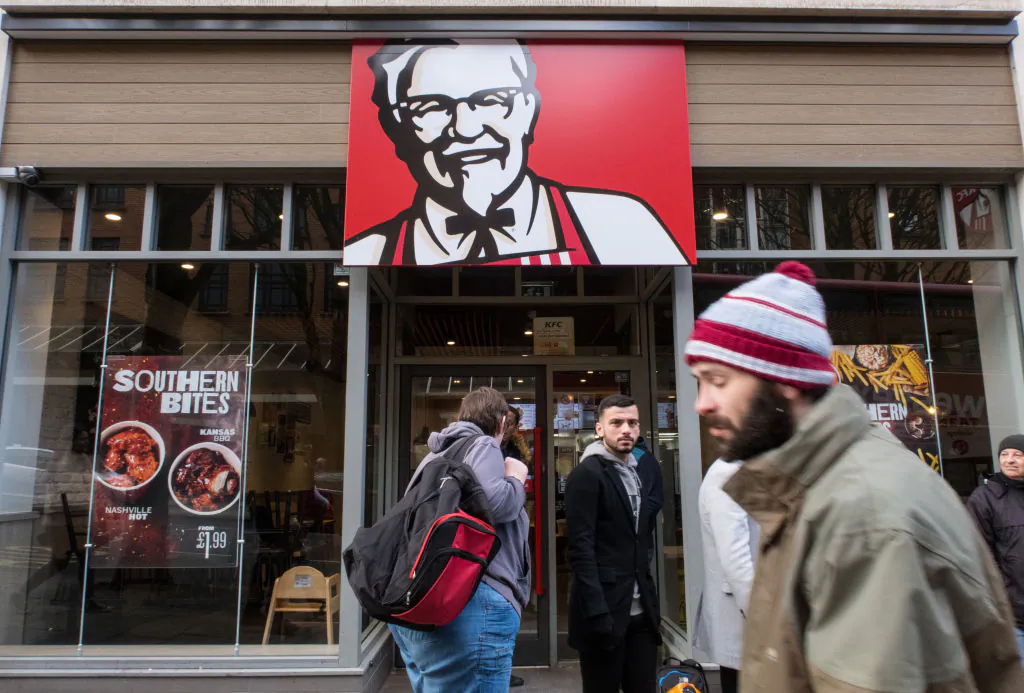 People walk by a KFC restaurant in Bristol, England, on Feb. 20, 2018. (Matt Cardy/Getty Images)