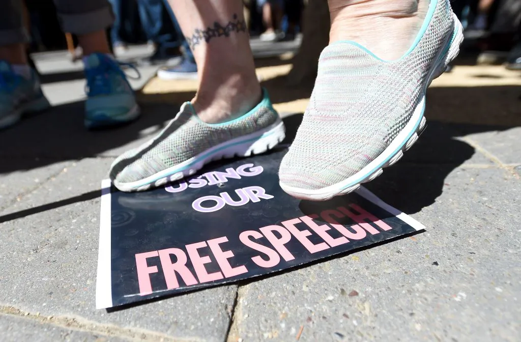 A woman stomps on a free speech sign at the University of California–Berkeley on Sept. 24, 2017. (Josh Edelson/AFP/Getty Images)