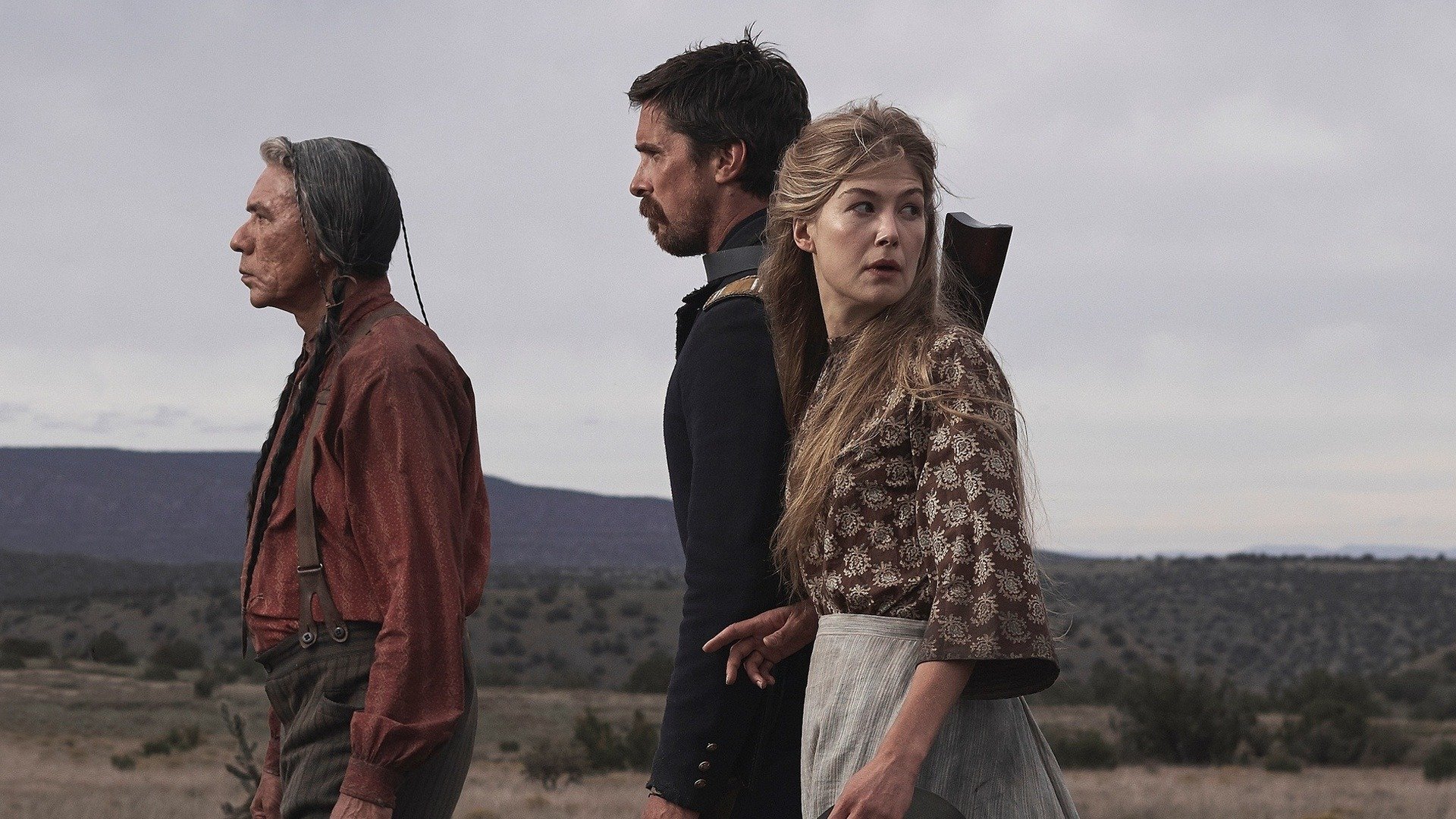 two men and a woman in hostiles