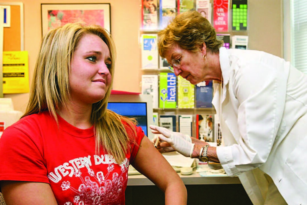 A student at the University of Iowa receives a mumps, measles, and rubella vaccination shot at the school’s student health service in Iowa City, Iowa, in this file photo. (MARK KEGANS/GETTY IMAGES) 