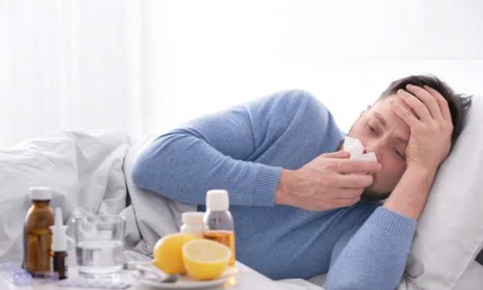 Influenza gets a foothold in the respiratory tract but can make a person feel bad all over. (Africa Studio/Shutterstock.com)