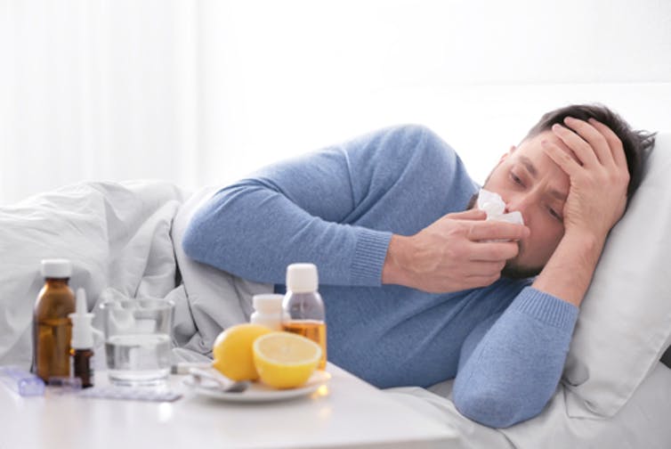 Influenza gets a foothold in the respiratory tract but can make a person feel bad all over. (Africa Studio/Shutterstock.com)