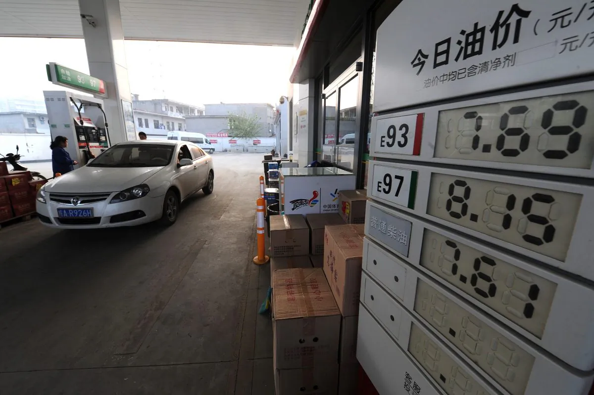 A car fills up at a petrol station in Hefei City, in east China's Anhui Province on May 10, 2012. (STR/AFP/GettyImages)
