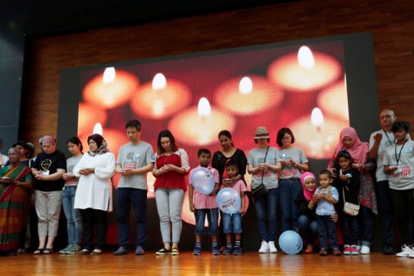 Families hold candles during fourth annual remembrance event for missing MH370, in Kuala Lumpur