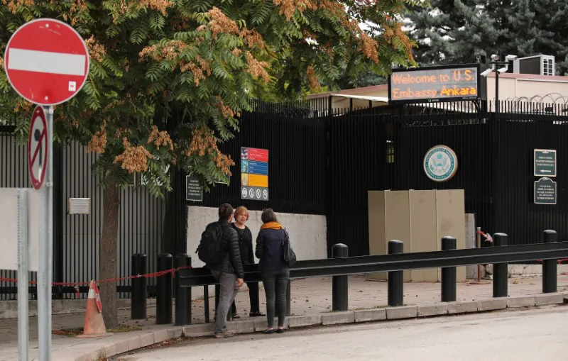 People wait in front of the visa application office entrance of the U.S. Embassy in Ankara, Turkey, Oct. 9, 2017. (Reuters/Umit Bektas)