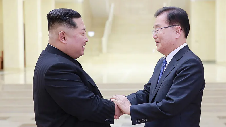 Chung Eui-Yong (R), head of the presidential National Security Office shakes hands with North Korean leader Kim Jong-Un (L) during their meeting in Pyongyang, North Korea, on March 5, 2018. (South Korean Presidential Blue House via Getty Images)