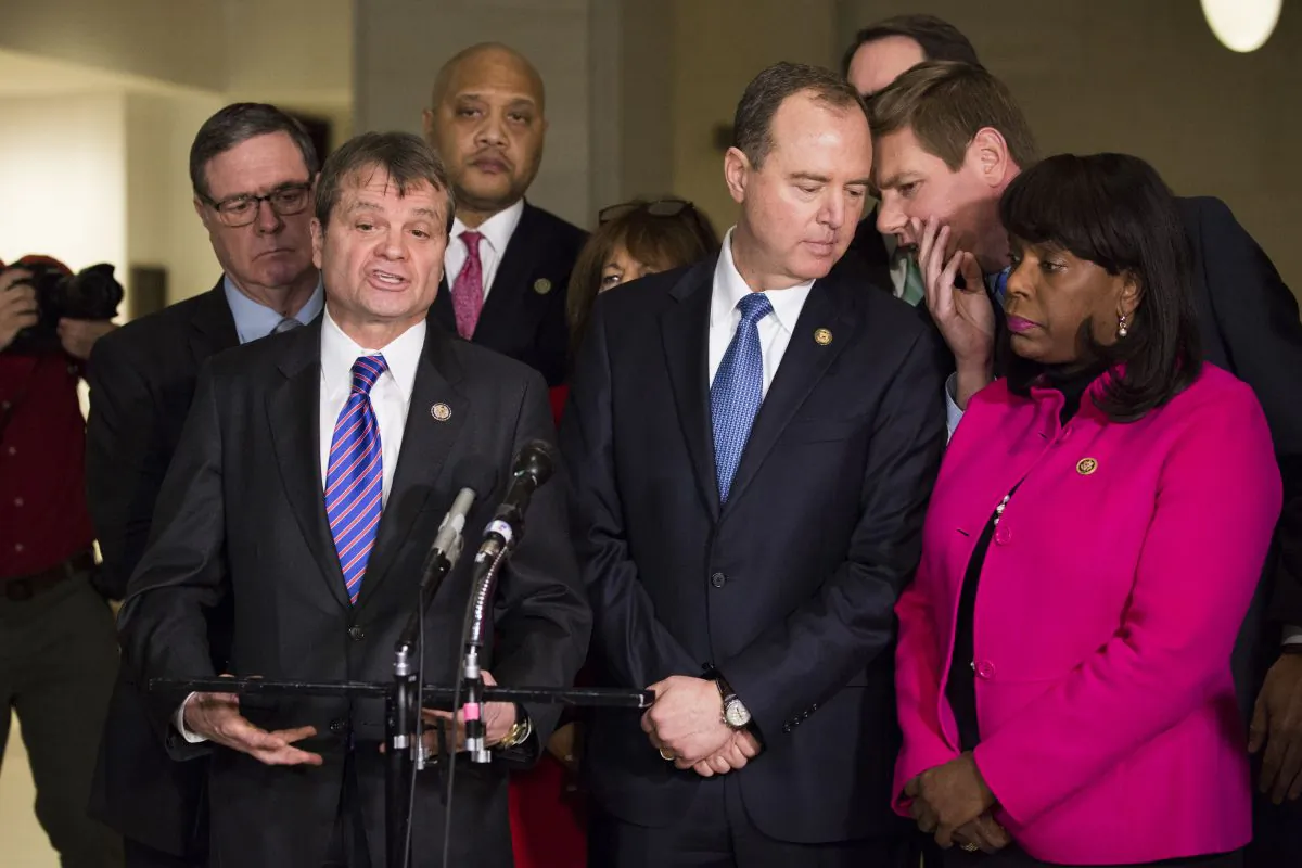Rep. Adam Schiff (D-Calif.) (3rd from R) and members of the House Intelligence Committee talk to media on Capitol Hill, Washington, Jan. 29, 2018, after voting to publicly release a memo detailing potential abuse of power at the highest levels of the Department of Justice and the FBI. (Samira Bouaou/The Epoch Times)