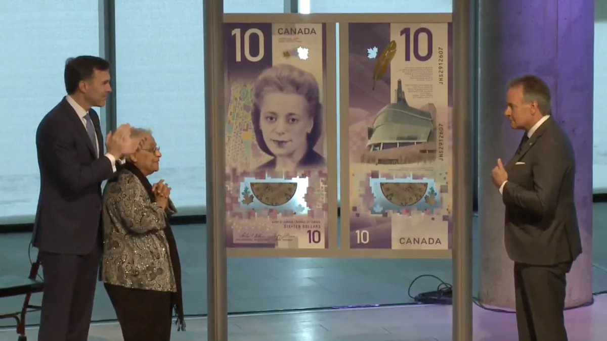 (L to R) Finance Minister Bill Morneau, Wanda Robson, and Bank of Canada Governor Stephen Poloz at the unveiling of the new $10 note in Halifax, Nova Scotia, on March 8, 2018. (Bank of Canada / screenshot)