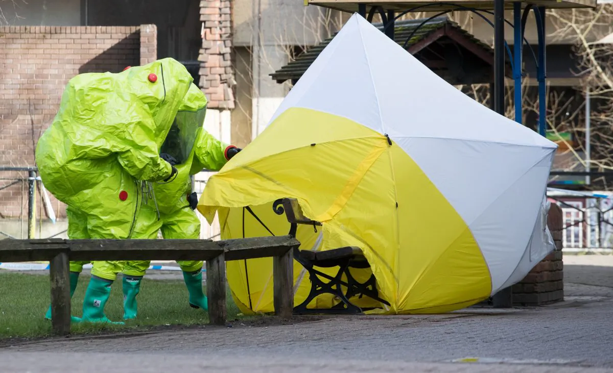 Specialist officers in protective suits secure the police forensic tent which is covering the bench where Sergei Skripal and his daughter were found critically ill on March 4 and were taken to hospital sparking a major incident in Salisbury Wiltshire, England on March 8, 2018. (Matt Cardy/Getty Images)