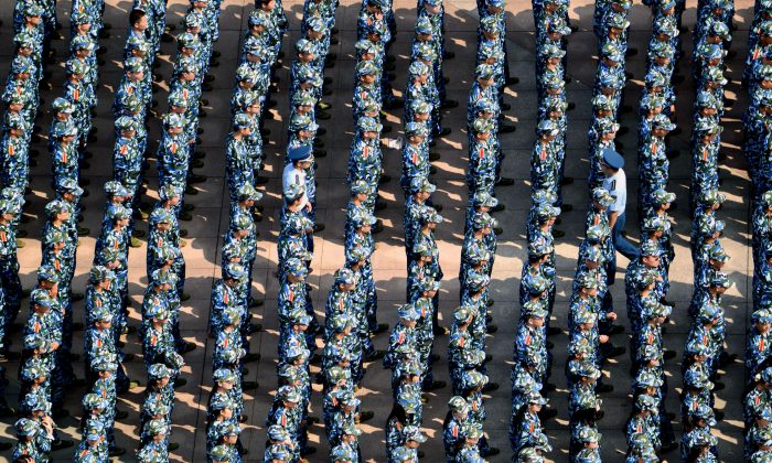 About 7,000 freshmen wearing fatigues gather at the Wuhan University of Technology during a military training in Wuhan City, Hubei Province on Sept. 14, 2015.  (VCG via Getty Images)