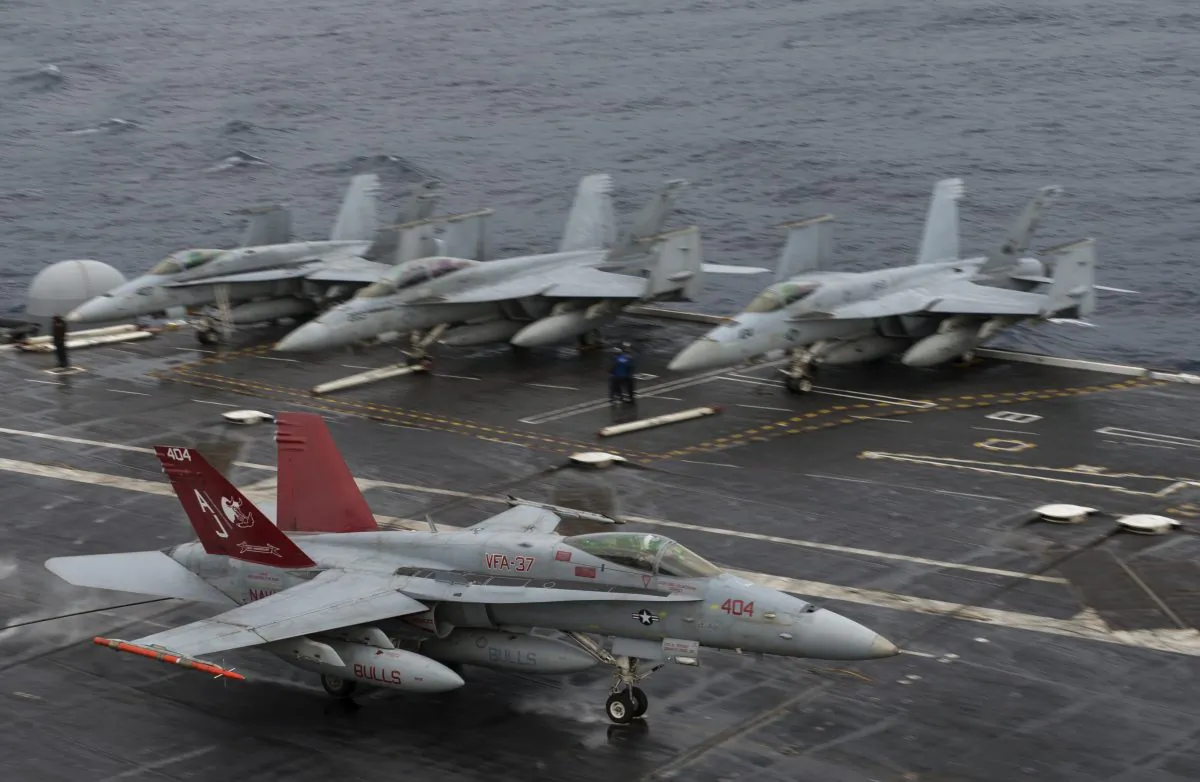 An F/A-18 Hornet lands on the deck of the USS George H.W. Bush aircraft carrier in the Atlantic ocean on Oct. 25, 2017. (Andrew Caballero-Reynolds/AFP/Getty Images)