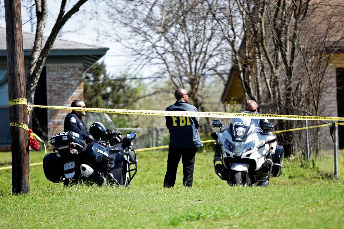 Police and FBI officers guard the scene of an explosion in Austin, Texas, on March 12, 2018. (Sergio Flores/Reuters)