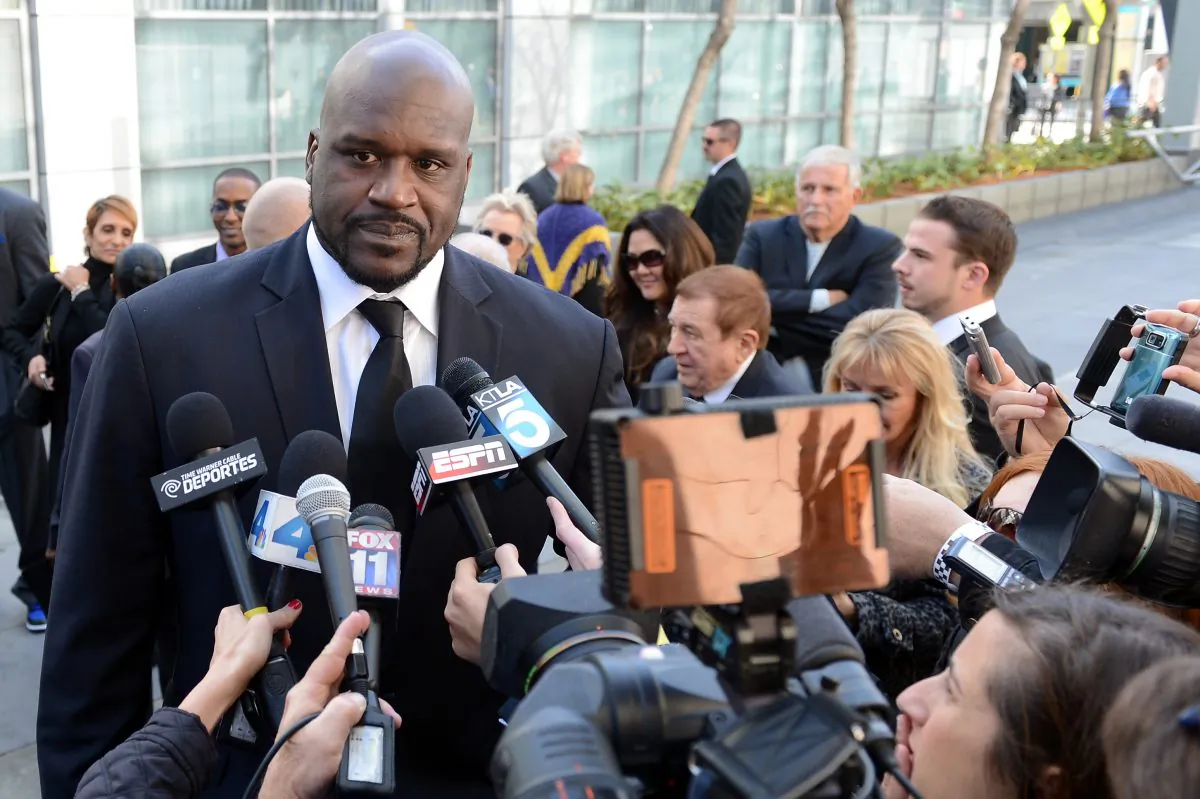 Former Los Angeles Lakers star Shaquille O'Neal addresses the media before a memorial service for Los Angeles Lakers owner Dr. Jerry Buss at the Nokia Theatre in Los Angeles on Feb. 21, 2013. (Photo by Harry How/Getty Images)