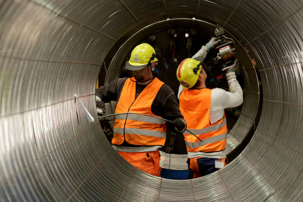 In this file photo, workers are working on a pipe in the production hall at the Nord Stream 2 facility in Sassnitz, Germany.  (Carsten Koall/Getty Images)