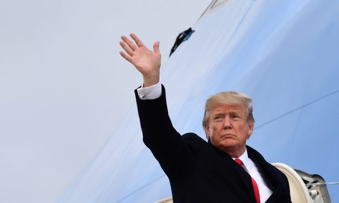 US President Donald Trump waves before boarding the Air Force One ahead of his departure from Zurich Airport in Zurich on Jan. 26, 2018. (Nicholas Kamm/AFP/Getty Images)