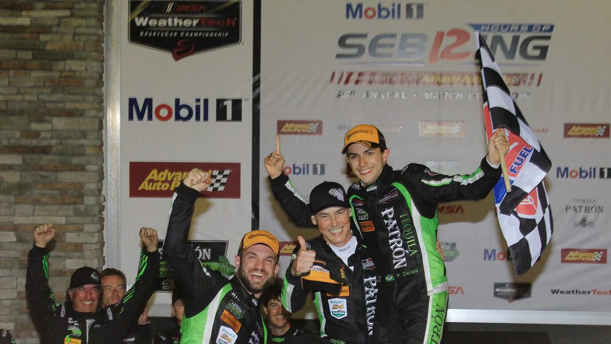 (Front L–R) Nicolas Lapierre, Johannes van Cverbeek and Pipo Derani celebrate winning the 2018 IMSA WeatherTech Sebring 12 Hours. (Chris Jasurek/Epoch Times)