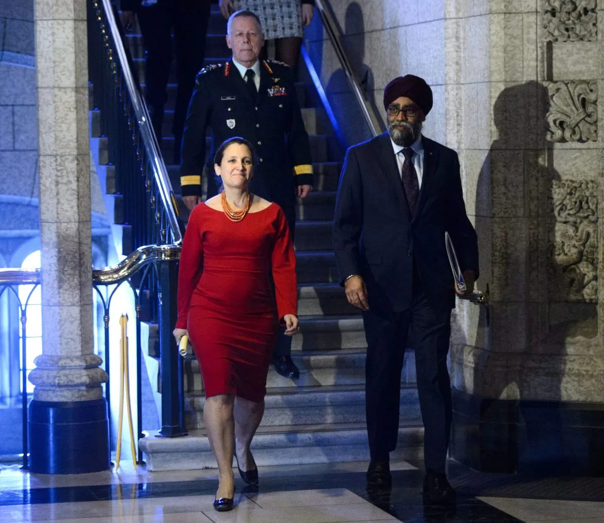 Minister of National Defence Minister Harjit Sajjan, Minister of Foreign Affairs Chrystia Freeland, and Chief of Defence Staff Jonathan Vance arrive to take part in a press conference on Canada's peacekeeping mission to Mali in the foyer of the House of Commons on March 19, 2018. (The Canadian Press/Sean Kilpatrick)