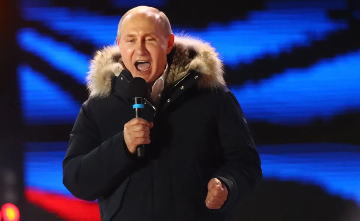 Russian President and Presidential candidate Vladimir Putin delivers a speech during a rally and concert marking the fourth anniversary of Russia's annexation of the Crimea region, at Manezhnaya Square in central Moscow, Russia, on March 18, 2018. (David Mdzinarishvili/Reuters)