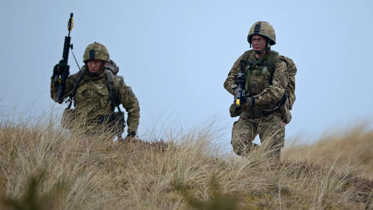 Royal Marines from 42 Commando take part in an exercise at Barry Buddon simulating an attack on shores of a hostile country in Carnoustie, Scotland on April 12, 2013. (Photo by Jeff J Mitchell/Getty Images)