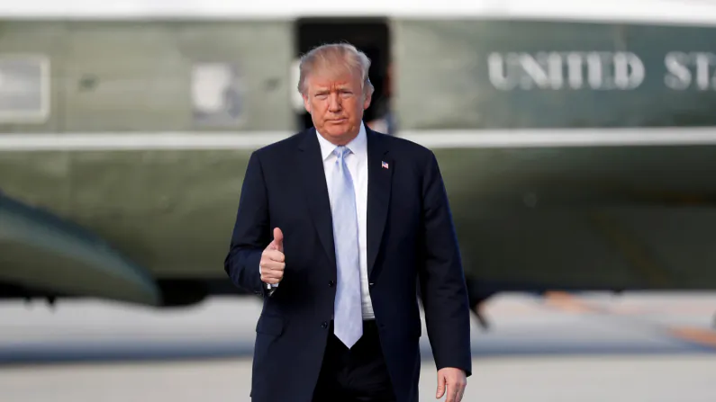 President Donald Trump gives a thumbs up as he departs Los Angeles on March 14, 2018. (Reuters/Kevin Lamarque)