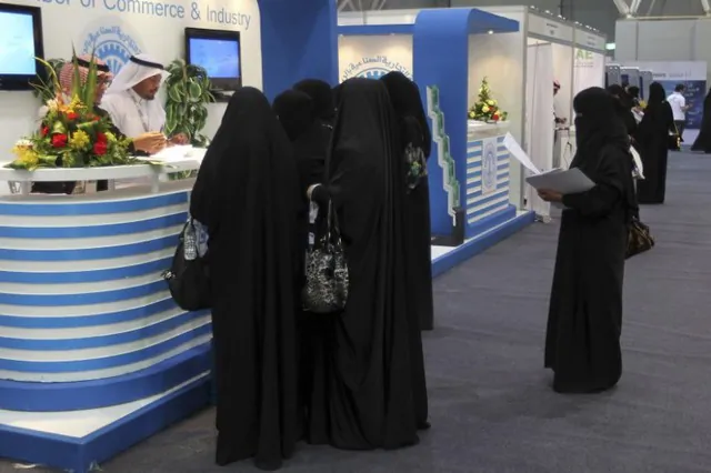 Saudi Arabian women, seeking a job, talk with recruiters during a job fair in Riyadh Jan. 25, 2012.  (Reuters/Stringer)
