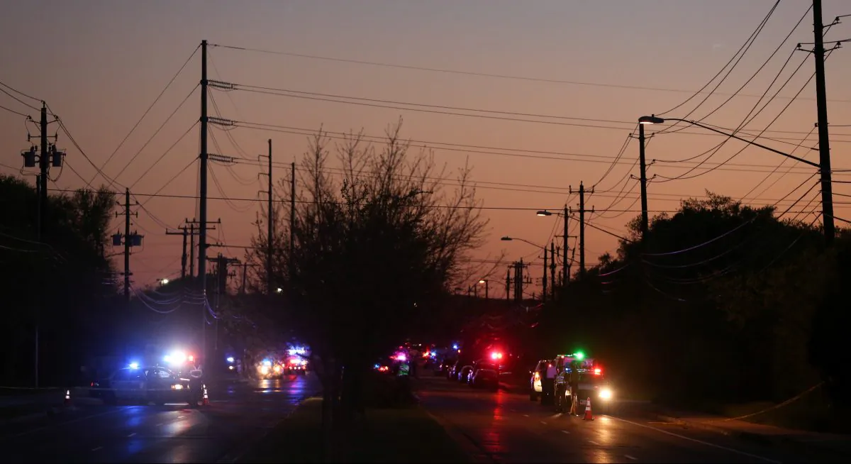 Law enforcement personnel investigate an incident that they said involved an incendiary device in the 9800 block of Brodie Lane in Austin, Texas, U.S., March 20, 2018. (Reuters/Loren Elliott)