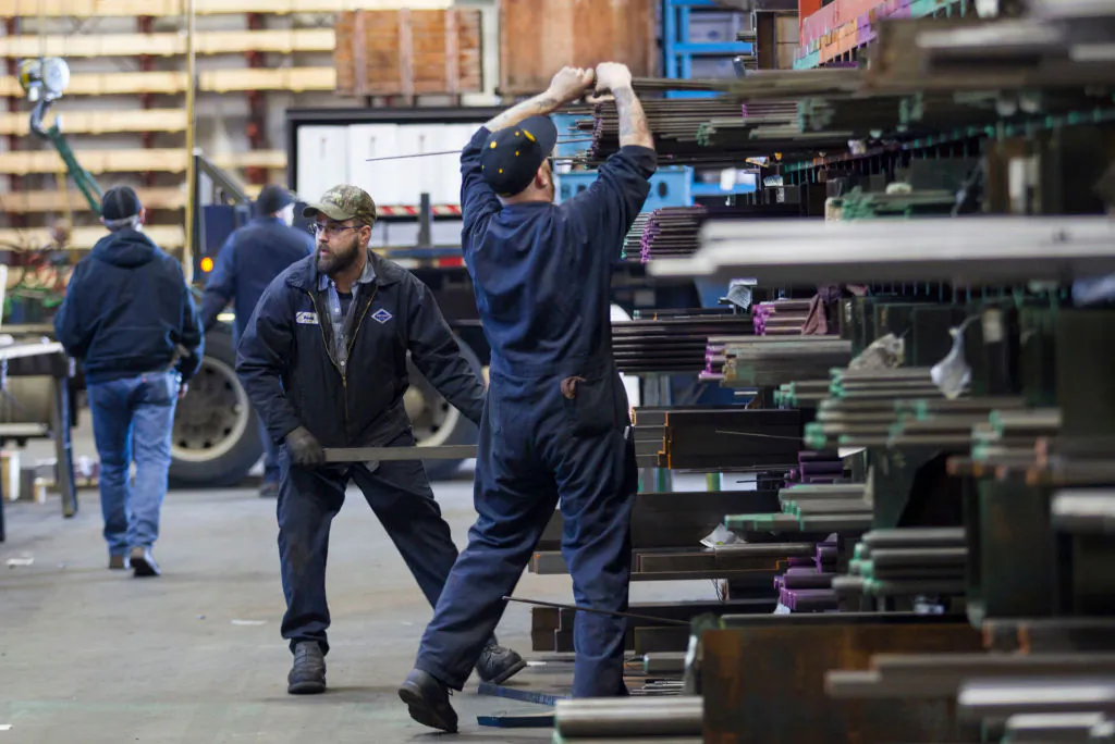 Laborers fill orders of machine grade steel to be shipped throughout the Pacific Northwest at the Pacific Machinery & Tool Steel Company in Portland, Oregon, on March 6, 2018. (Natalie Behring/Getty Images)