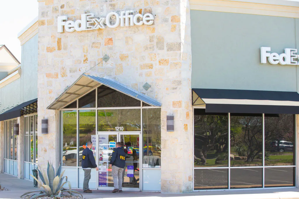 FBI Agents investigate at the Sunset Valley FedEx store located on Brodie Lane in Austin, Texas, which is linked to the package bomb which exploded on a conveyor belt in the sorting facility in Schertz, Texas on March 20, 2018. (SUZANNE CORDEIRO/AFP/Getty Images)