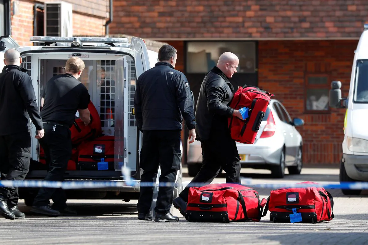 Police officers prepare equipment as inspectors from the Prohibition of Chemical Weapons (OPCW) begin work at the scene of the nerve agent attack on former Russian agent Sergei Skripal, in Salisbury, Britain March 21, 2018. (Reuters/Peter Nicholls)