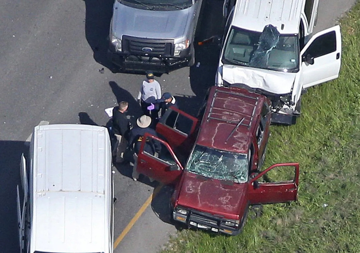Law enforcement personnel investigate the scene where the Texas bombing suspect blew himself up on the side of a highway north of Austin in Round Rock, Texas. (Reuters/Loren Elliott)