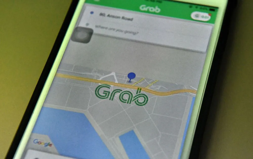 This photo illustration taken on March 26, 2018 shows the Grab booking application seen on a smart phone in Singapore. 
(Roslan Rahman/AFP/Getty Images)