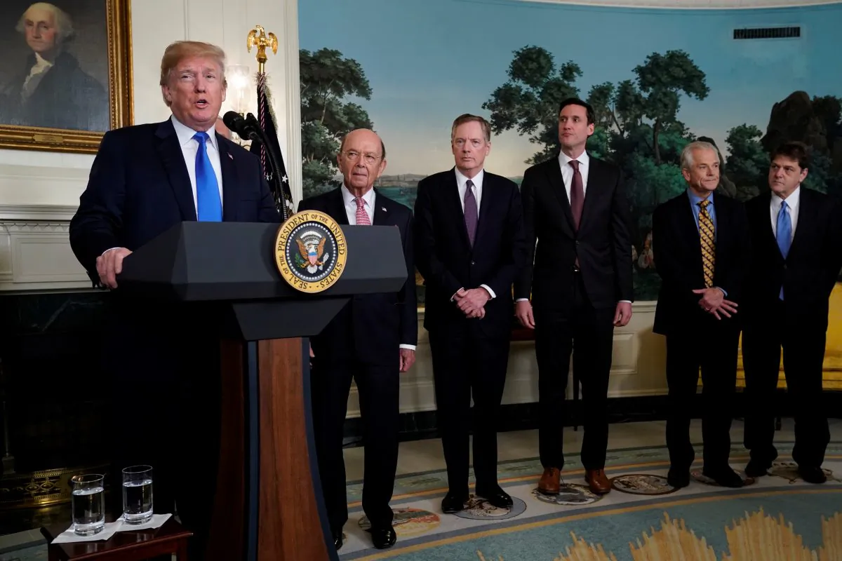U.S. President Donald Trump, flanked by Commerce Secretary Wilbur Ross, U.S. Trade Representative Robert Lighthizer, White House Homeland Security Advisor Tom Bossert, Assistant to the President Peter Navarro and Deputy Assistant to the President for International Economic Affairs Everett Eissenstat, delivers remarks before signing a memorandum on intellectual property tariffs on high-tech goods from China, at the White House in Washington, D.C., on March 22, 2018.  (Jonathan Ernst/Reuters)