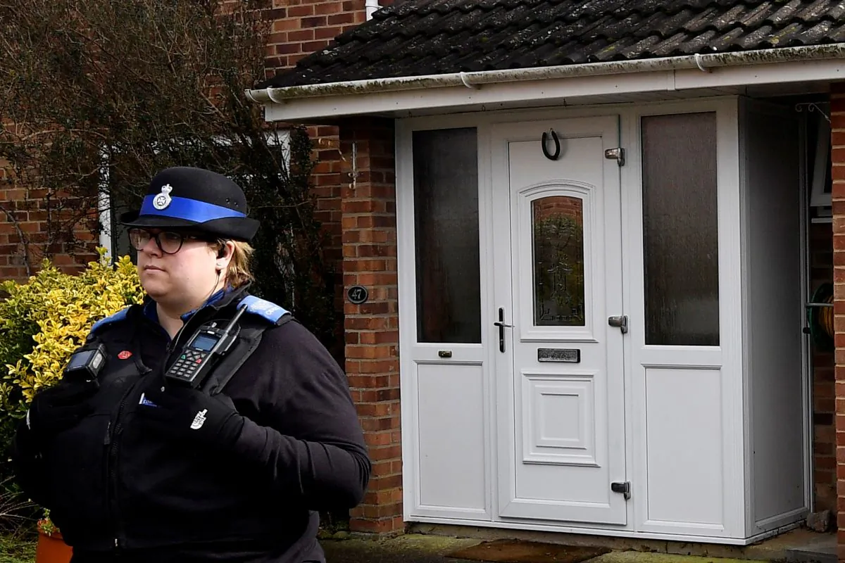 A police officer stands guard outside of the home of former Russian military intelligence officer Sergei Skripal, in Salisbury, Britain, March 6, 2018.  (Reuters/Toby Melville)