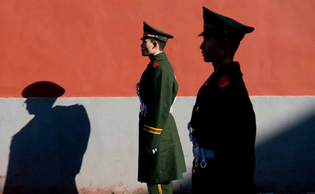 Members of the Chinese police stand guard in Beijing, China (Saul Loeb/AFP/Getty Images)