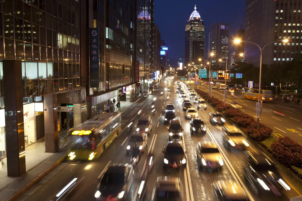 Traffic moving along a street in the evening in Taipei’s Hsin-yi district on April 15, 2013 in Taipei, Taiwan. (Ashley Pon/Getty Images)