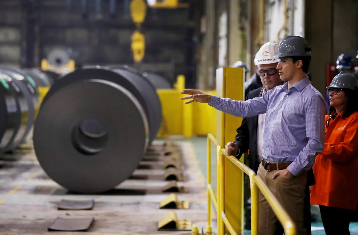 Canada's Prime Minister Justin Trudeau tours the ArcelorMittal Dofasco steel plant in Hamilton, Ontario, on March 13, 2018. (Mark Blinch/Reuters)