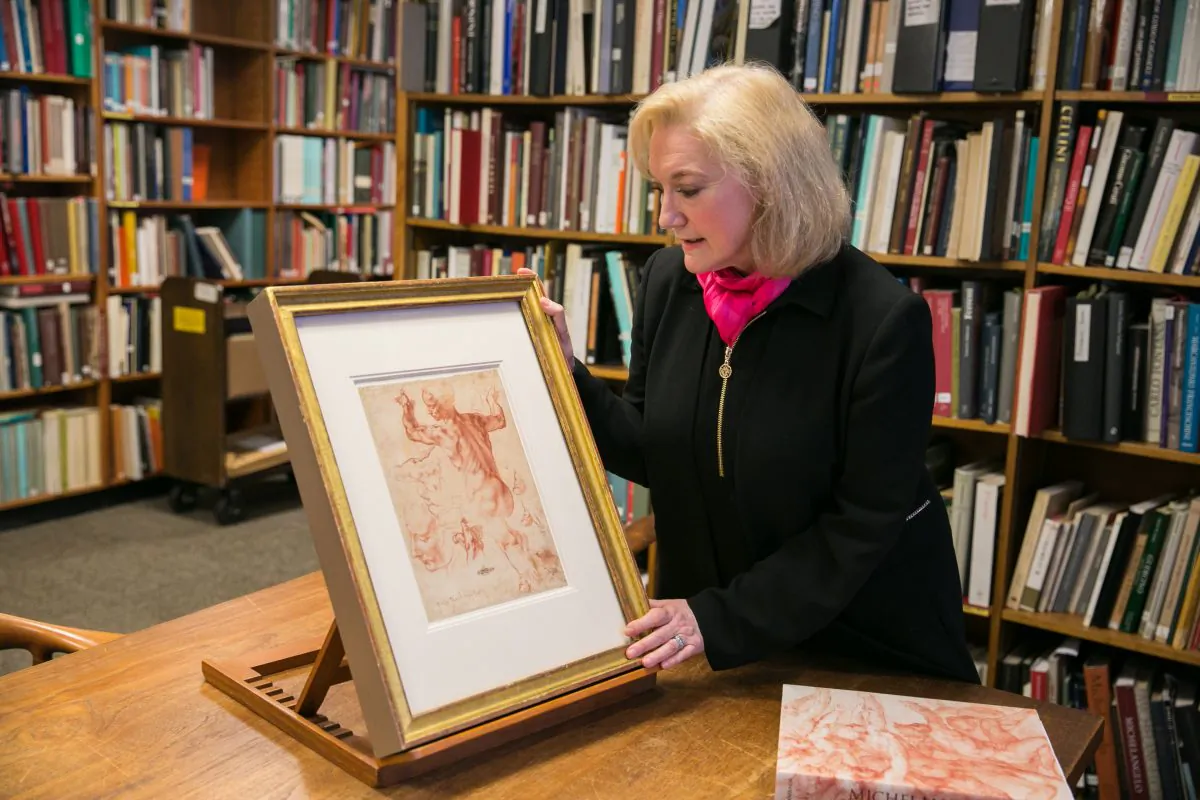 Carmen Bambach, curator of Italian and Spanish drawings at The Metropolitan Museum of Arts with "Studies for the Libyan Sibyl (recto),"  circa 1510–1511, by Michelangelo Buonarroti (1475–1564) in the study room for drawings and prints at The Metropolitan Museum of Art, on March 13, 2018. (Benjamin Chasteen/The Epoch Times)