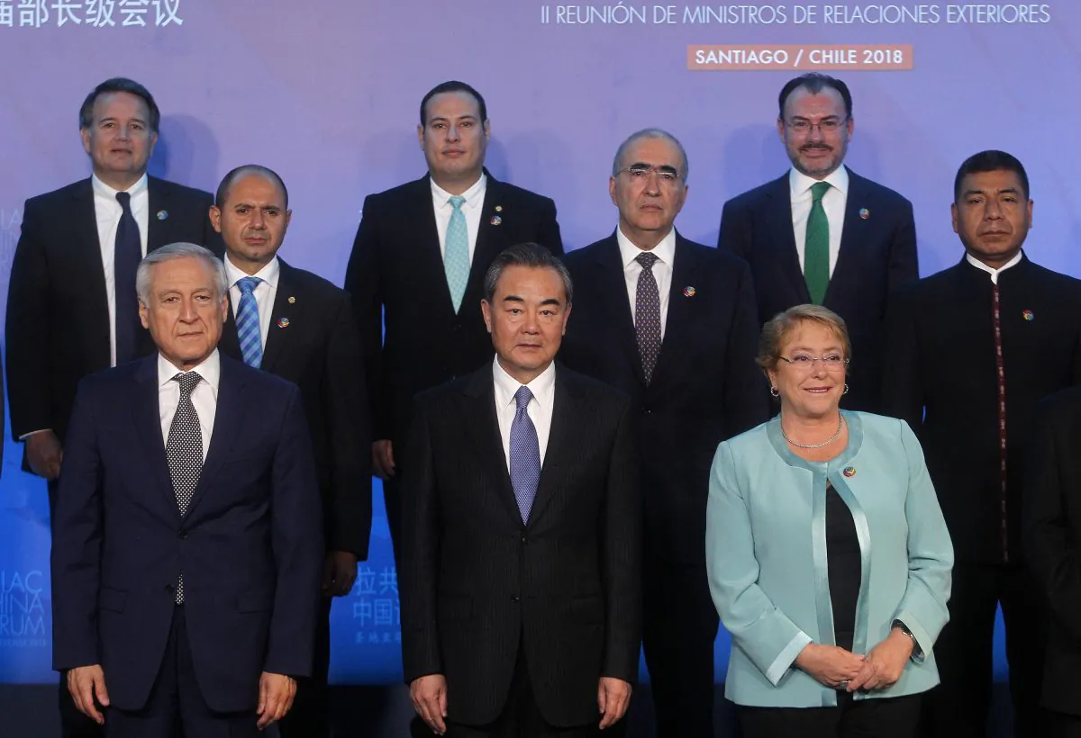 (Front L–R) Chile's Foreign Minister Heraldo Munoz, China's Foreign Minister Wang Yi, and Chilean President Michelle Bachelet at the Second Ministerial Meeting of the Forum of China and the Community of Latin American and Caribbean States (China-CELAC) in Santiago, on Jan. 22. (CLAUDIO REYES/AFP/Getty Images)