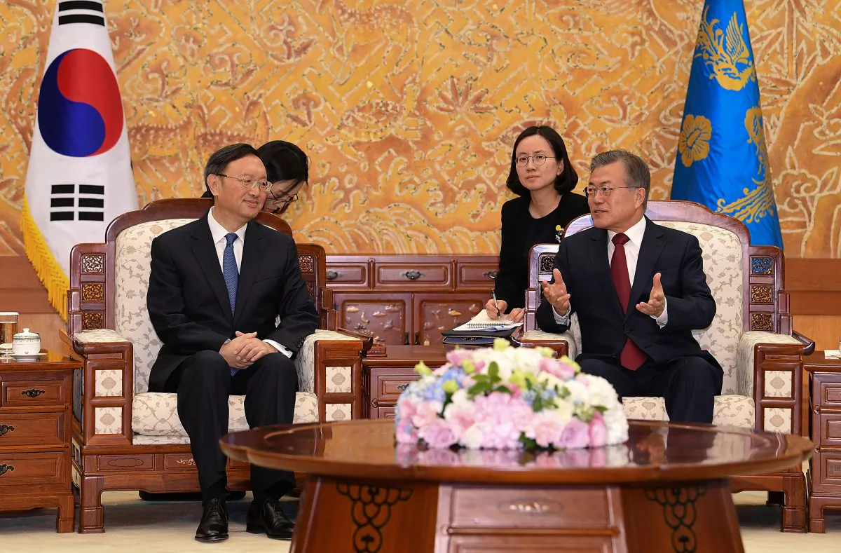 South Korean President Moon Jae-In (R) talks with Chinese diplomat Yang Jiechi at the Presidential Blue House in Seoul, South Korea on March 30, 2018. (Kim Min-Hee-Pool/Getty Images)