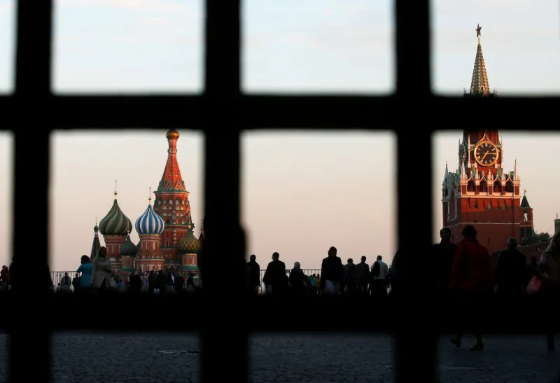 Red Square, St. Basil's Cathedral (L), and the Spasskaya Tower of the Kremlin are seen through a gate in central Moscow, on Sept. 18, 2014. (Maxim Zmeyev/Reuters)