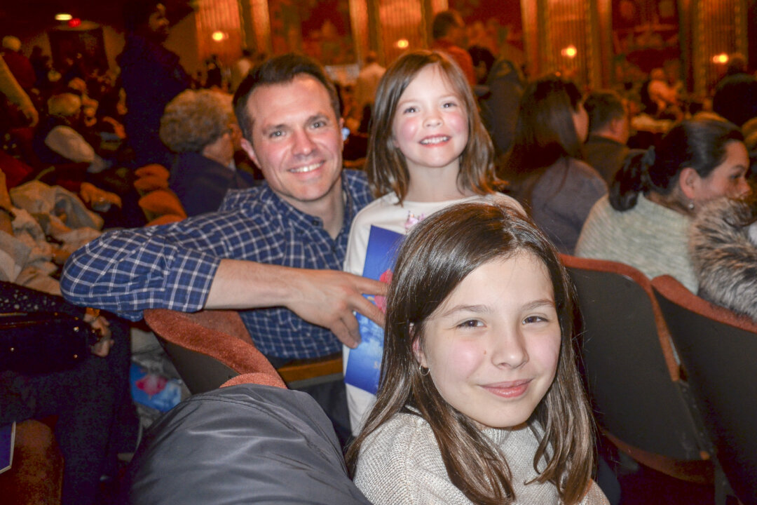 Andrew Huegli and his two daughters attended the Shen Yun performance at the Paramount Theatre in Aurora, Ill., on April 8, 2018. (Helen Peng/The Epoch Times)