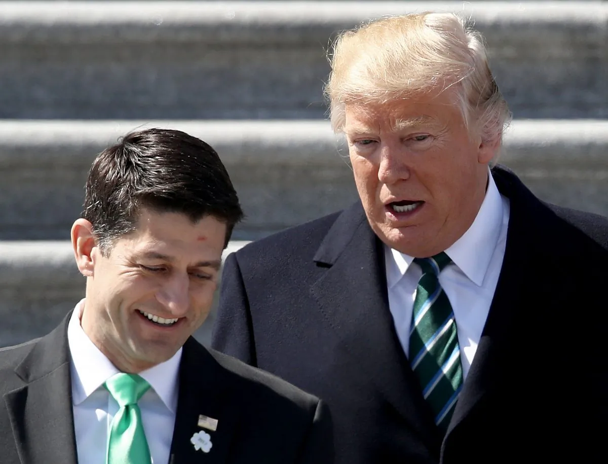 Then-President Donald Trump confers with then-U.S. Speaker of the House Paul Ryan (R-WI) following a luncheon celebrating St. Patrick's Day at the U.S. Capitol on March 16, 2017 in Washington, DC. (Win McNamee/Getty Images)