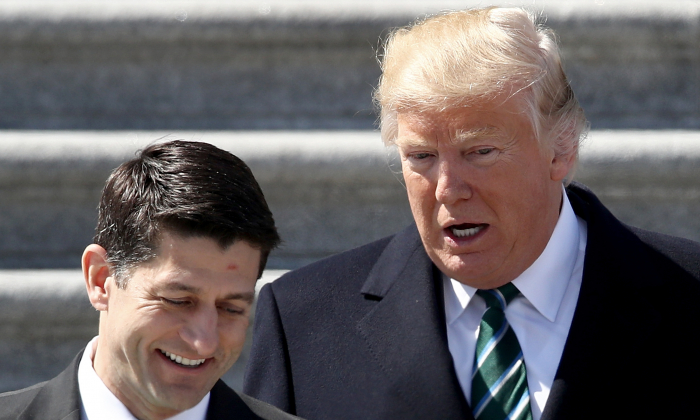 Then-President Donald Trump confers with then-U.S. Speaker of the House Paul Ryan (R-WI) following a luncheon celebrating St. Patrick's Day at the U.S. Capitol on March 16, 2017 in Washington, DC. (Win McNamee/Getty Images)