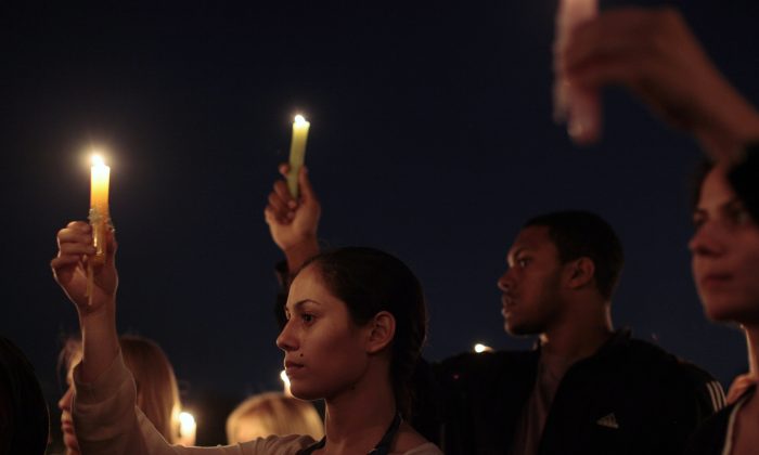 Students and visitors attend a candlelight vigil on campus at Virginia Tech April 16, 2012 in Blacksburg, Virginia. Virginia Tech is marking the fifth anniversary of the killing of 32 students and faculty in what was then the deadliest mass shooting in modern U.S. history. April 16, 2018 will mark the 11th anniversary of the deadly event. (Jared Soares/Getty Images)