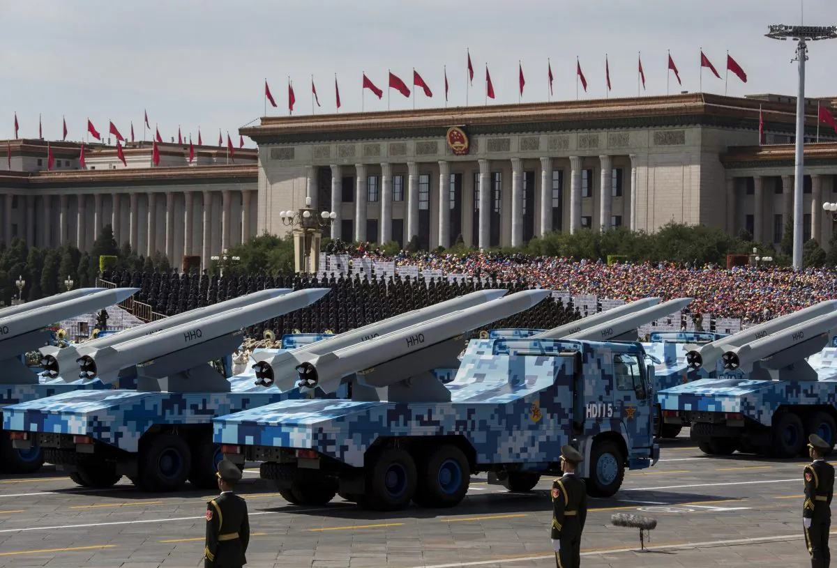 Chinese missiles are seen on trucks as they drive next to Tiananmen Square and the Great Hall of the People during a military parade on September 3, 2015 in Beijing, China. (Kevin Frayer/Getty Images)