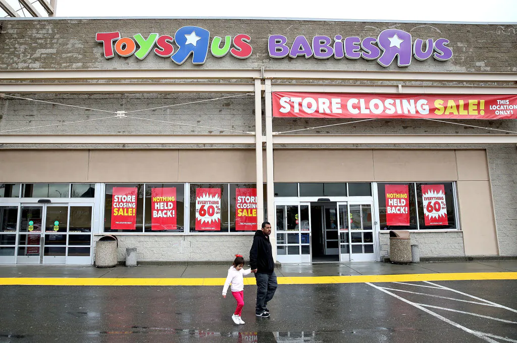 Customers leave a Toys R Us store on March 15, in Emeryville, Calif.. Toys R Us filed for liquidation in a U.S. Bankruptcy court and plans to close 735 stores leaving 33,000 workers without employment. (Justin Sullivan/Getty Images)